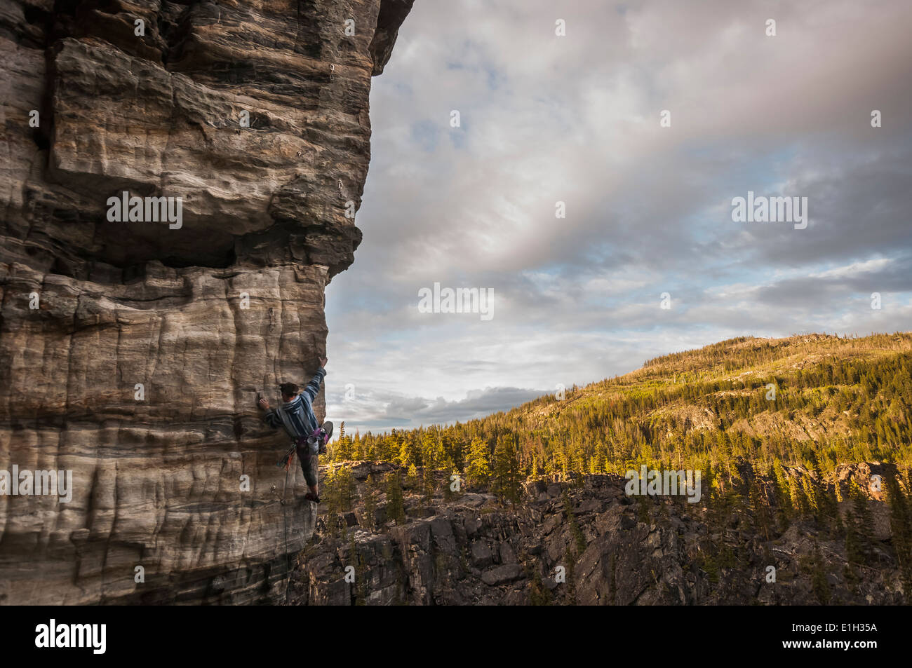 Male rock climber, climbing a rock wall at Boulder Fields, South