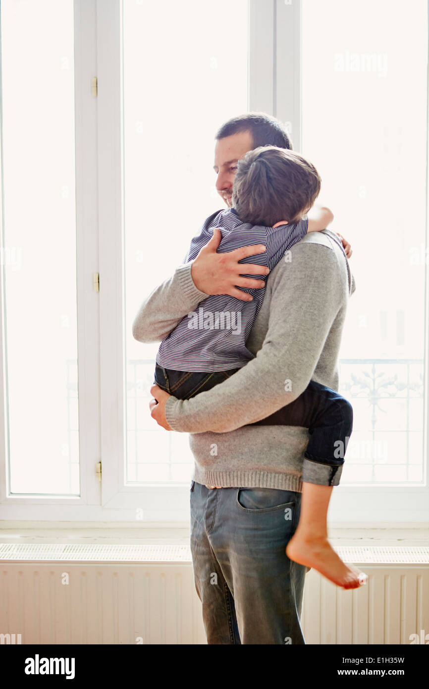 Boy showing affection to father Stock Photo