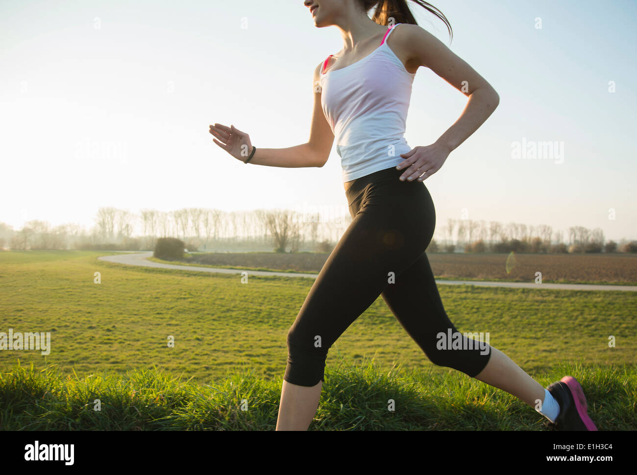 Cropped shot of young female runner Stock Photo