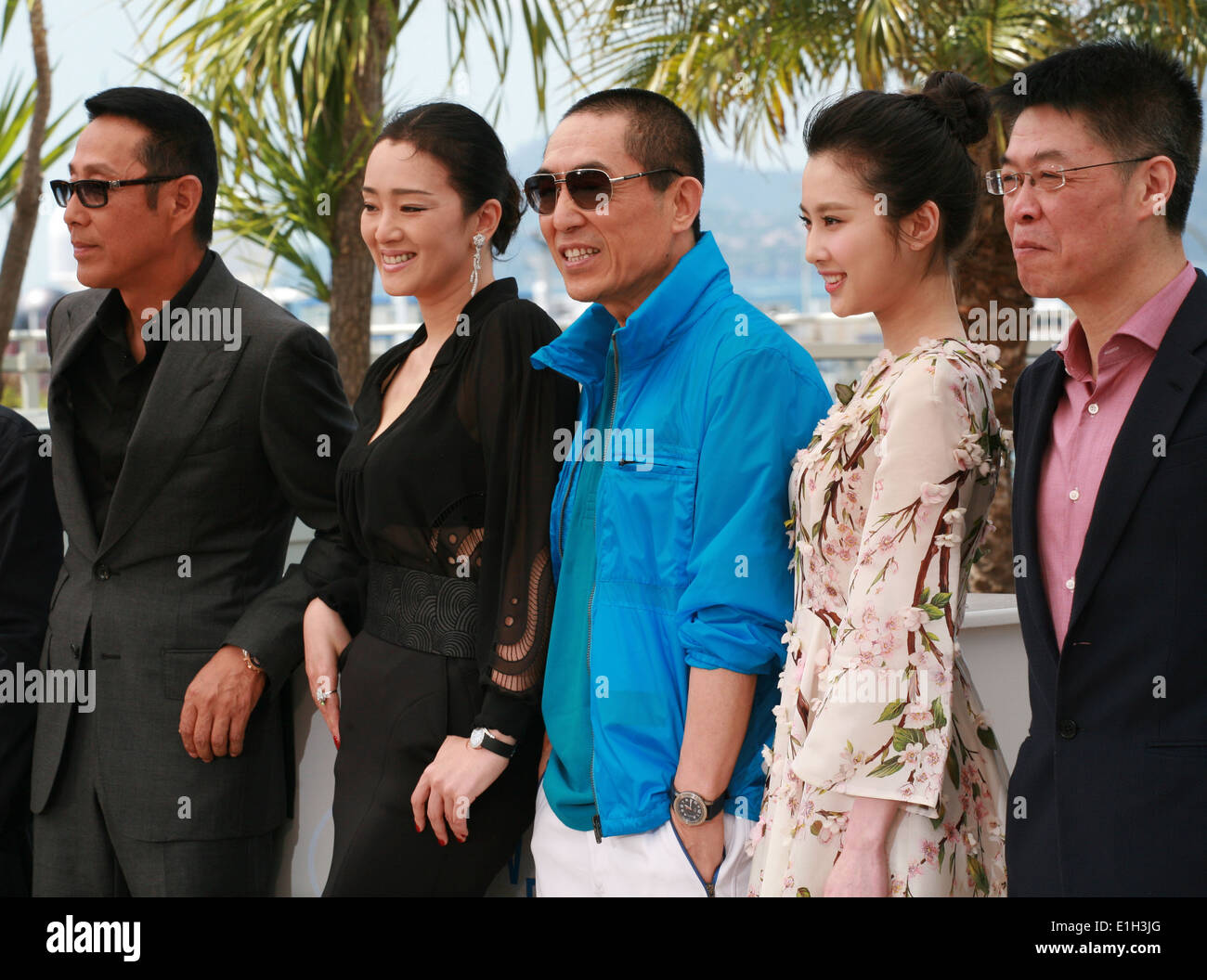 Actor Daoming Chen, actress Li Gong, director Yimou Zhang, actress Huiwen Zhang at the photo call for the film Coming Home 2014 Stock Photo