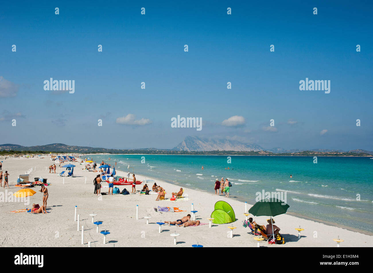 People and tourist enjoy clear water sea at La Cinta beach, San Teodoro, Olbia Tempio province, Sardinia, Italy Stock Photo