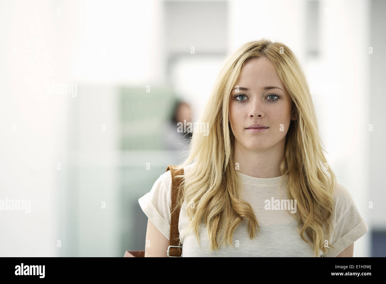 Portrait of young woman with long blonde hair Stock Photo