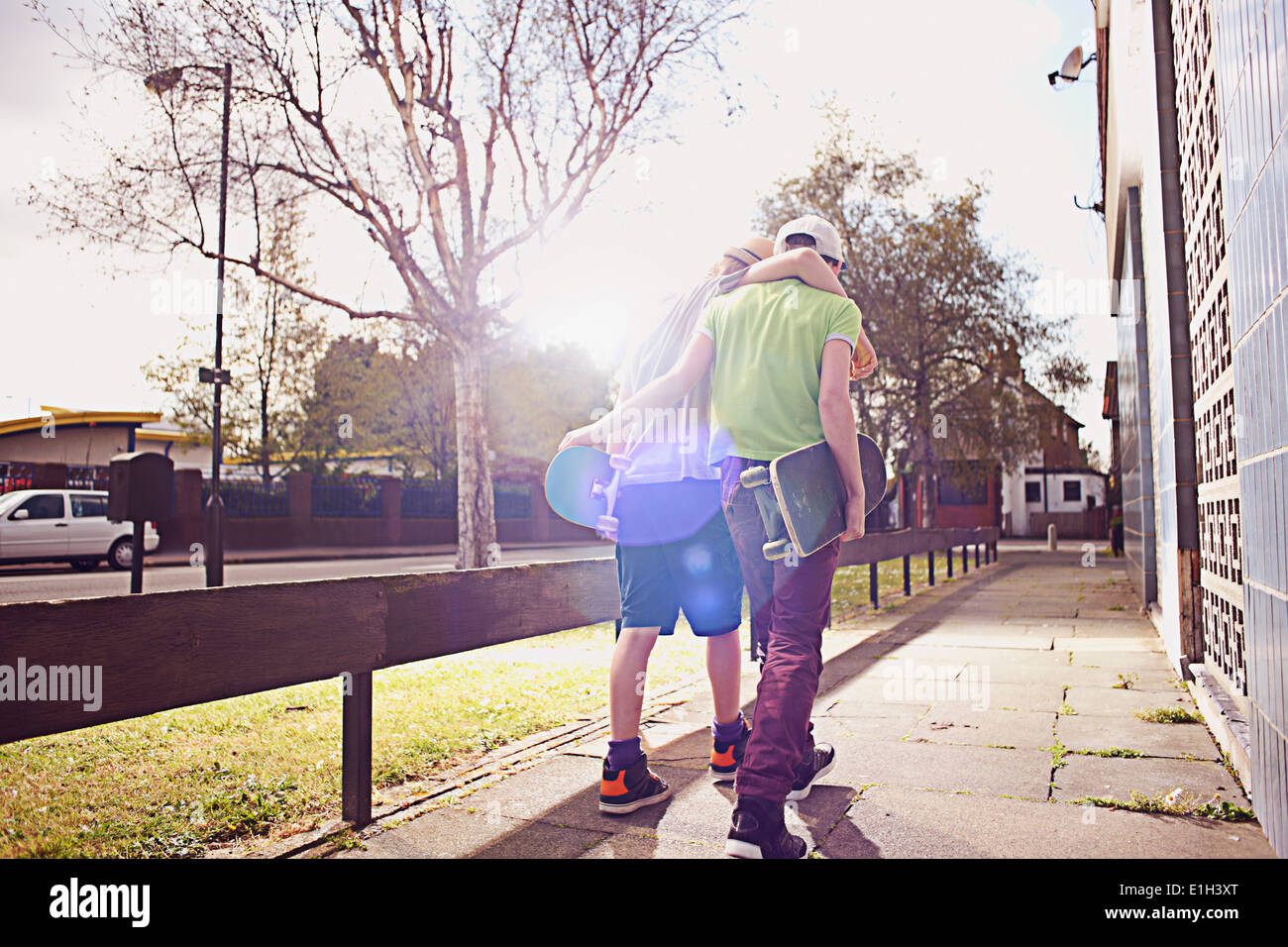 Arm around each other and boys hi-res stock photography and images - Alamy