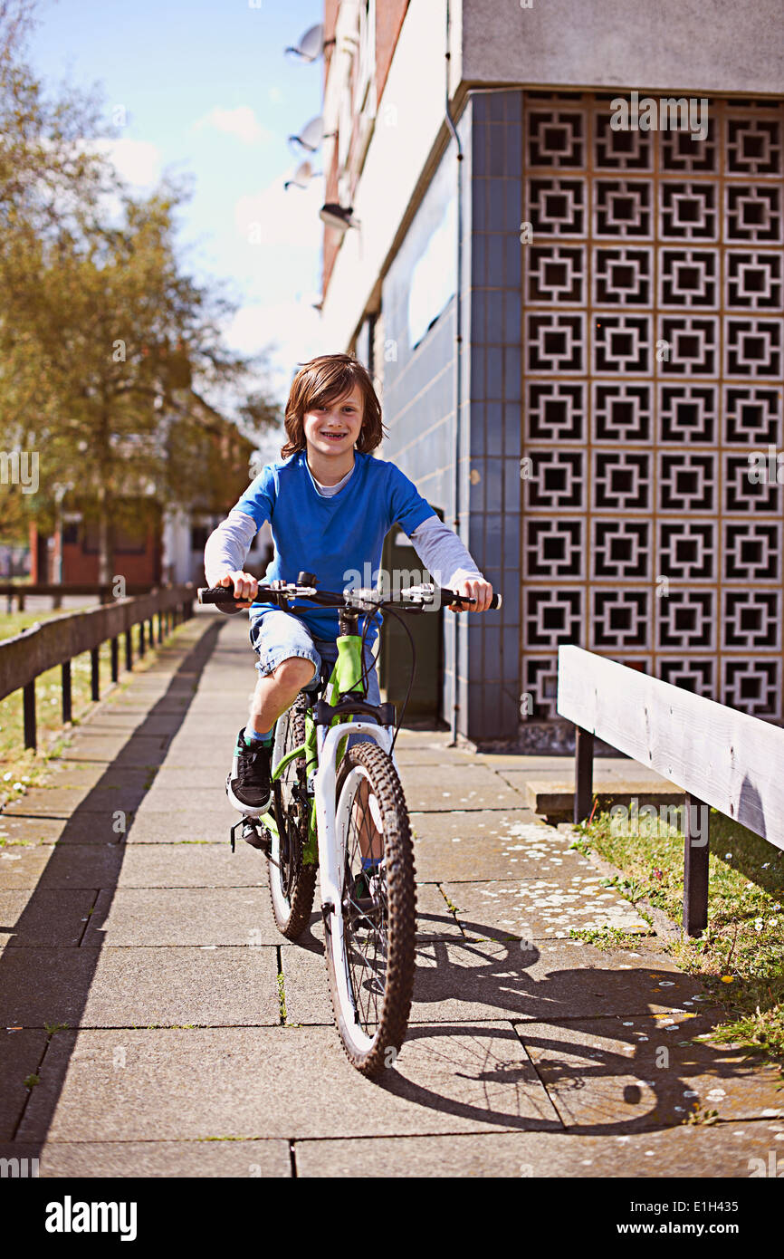 Portrait of boy cycling Stock Photo