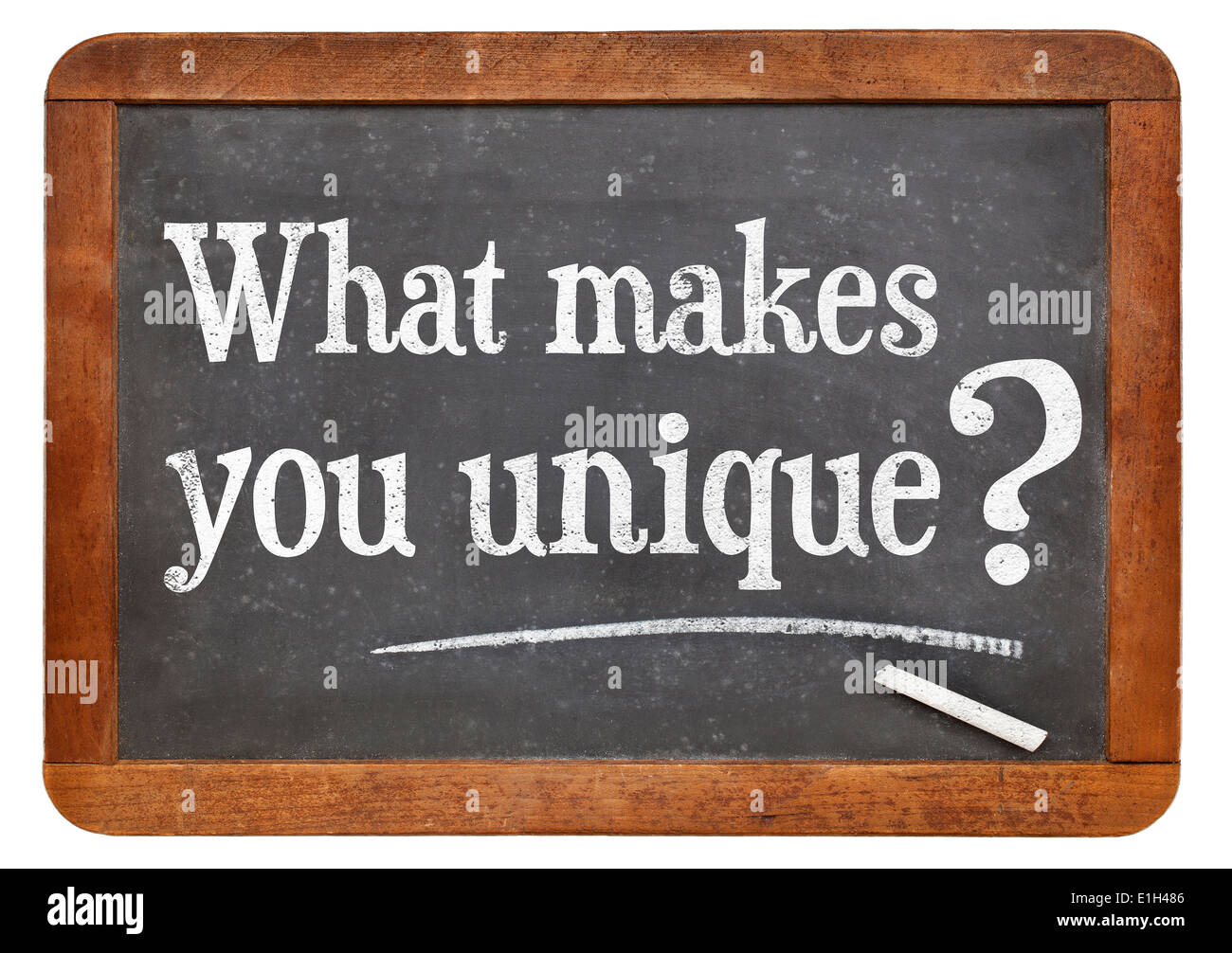 What makes you unique question on a vintage blackboard isolated on white Stock Photo