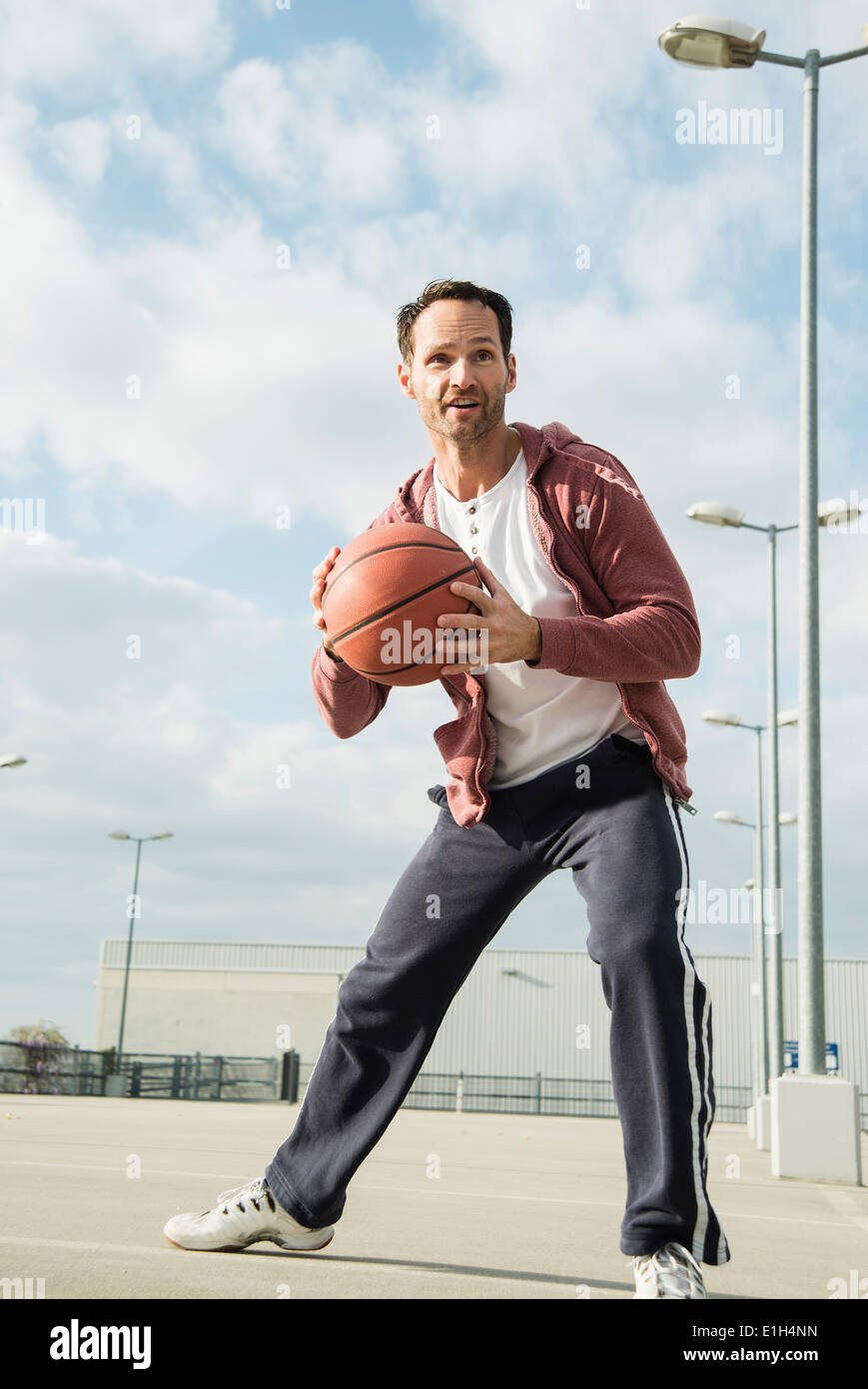 Basketball player about to throw basketball Stock Photo Alamy