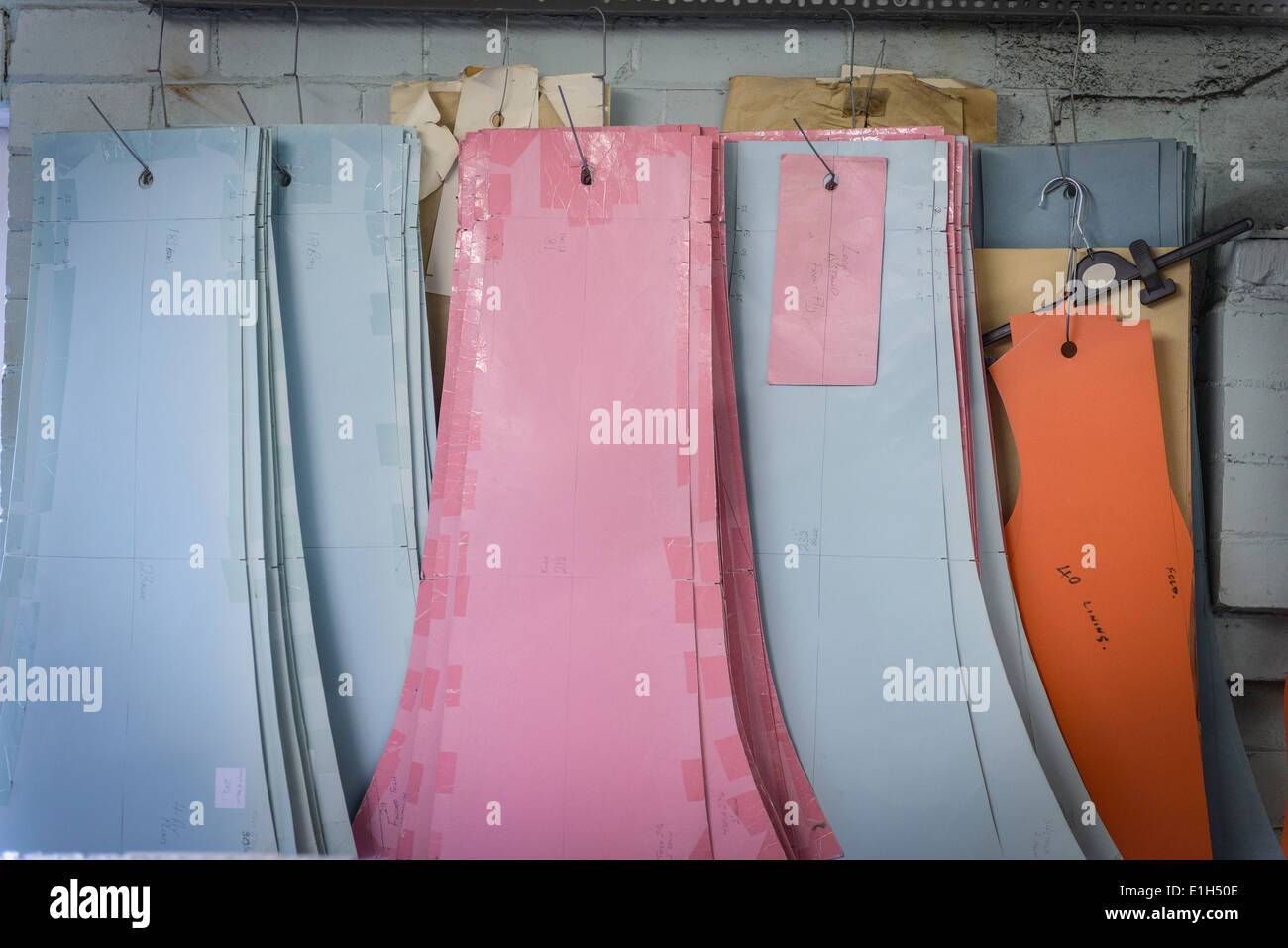 Patterns hanging in clothing factory Stock Photo