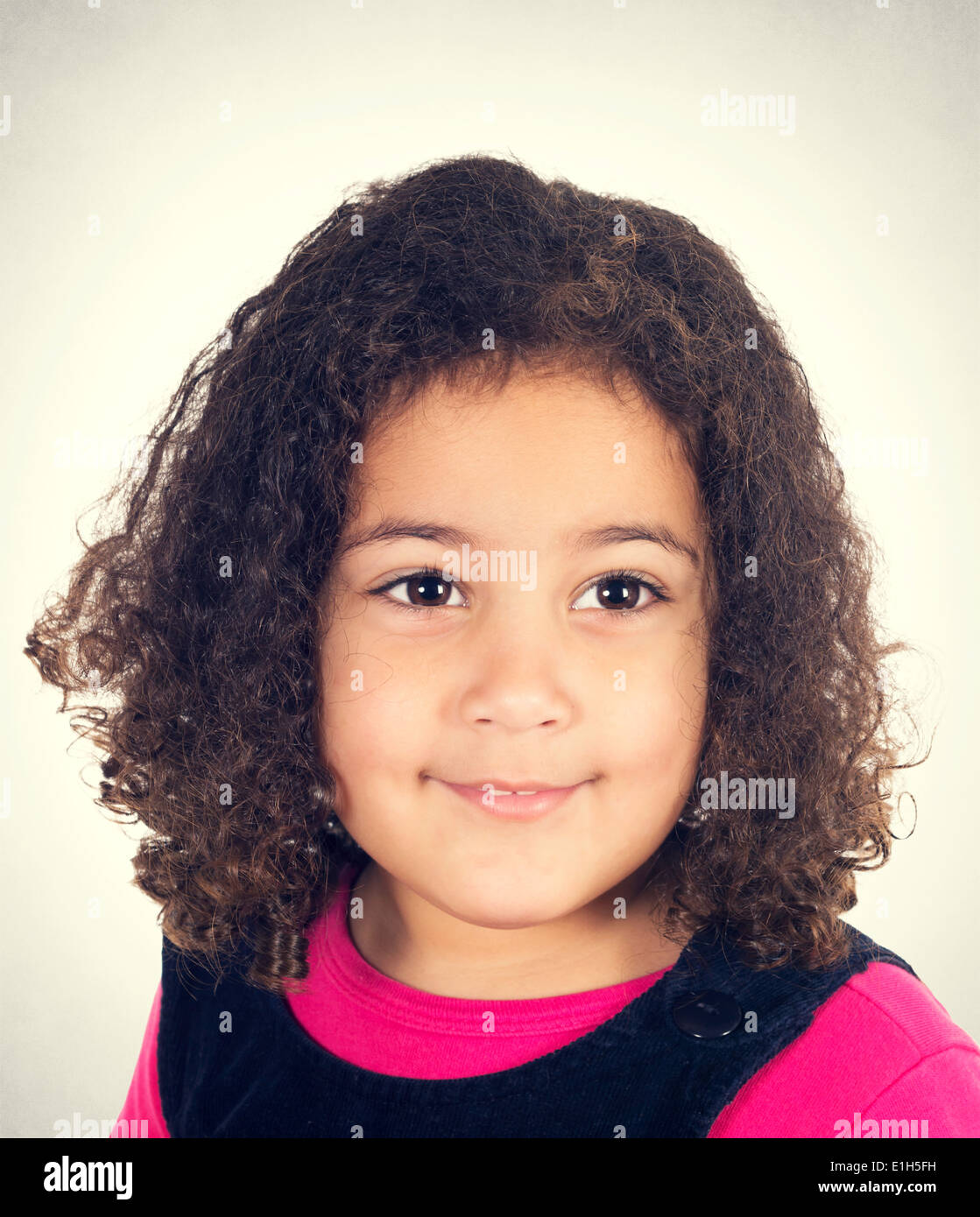 Portrait Of Beauty Little Girl With Curly Hairstyle Stock Photo