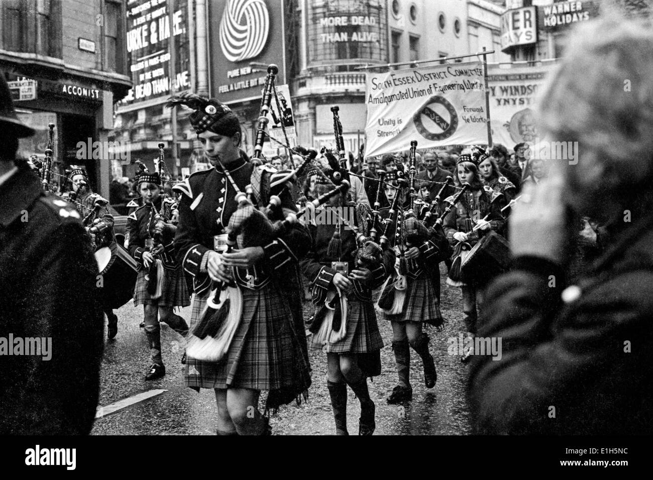 A pipe band marches through central London during the 1972 miners' strike. Stock Photo