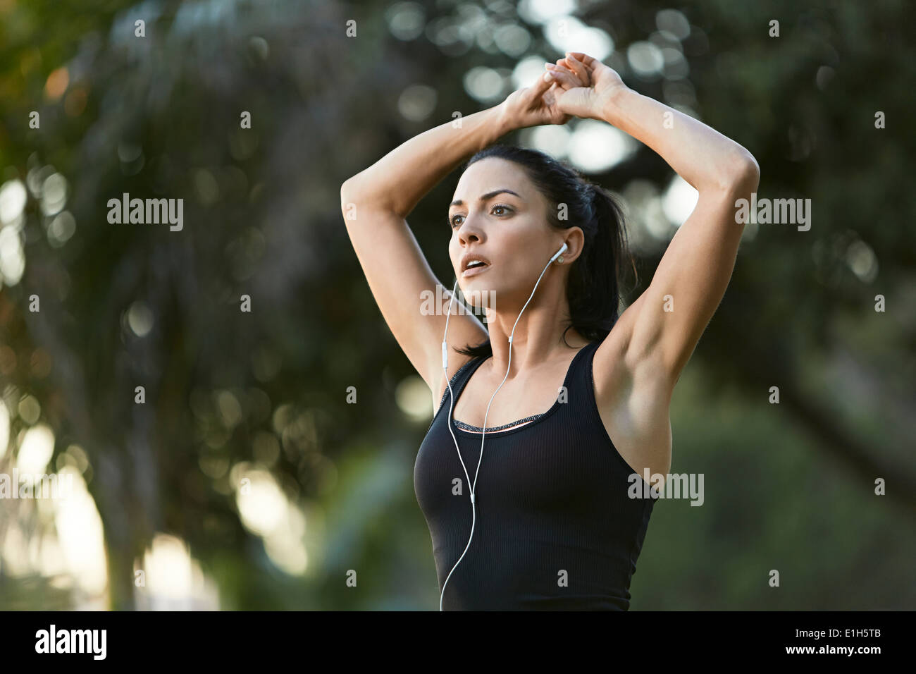 Mid adult woman stretching Stock Photo