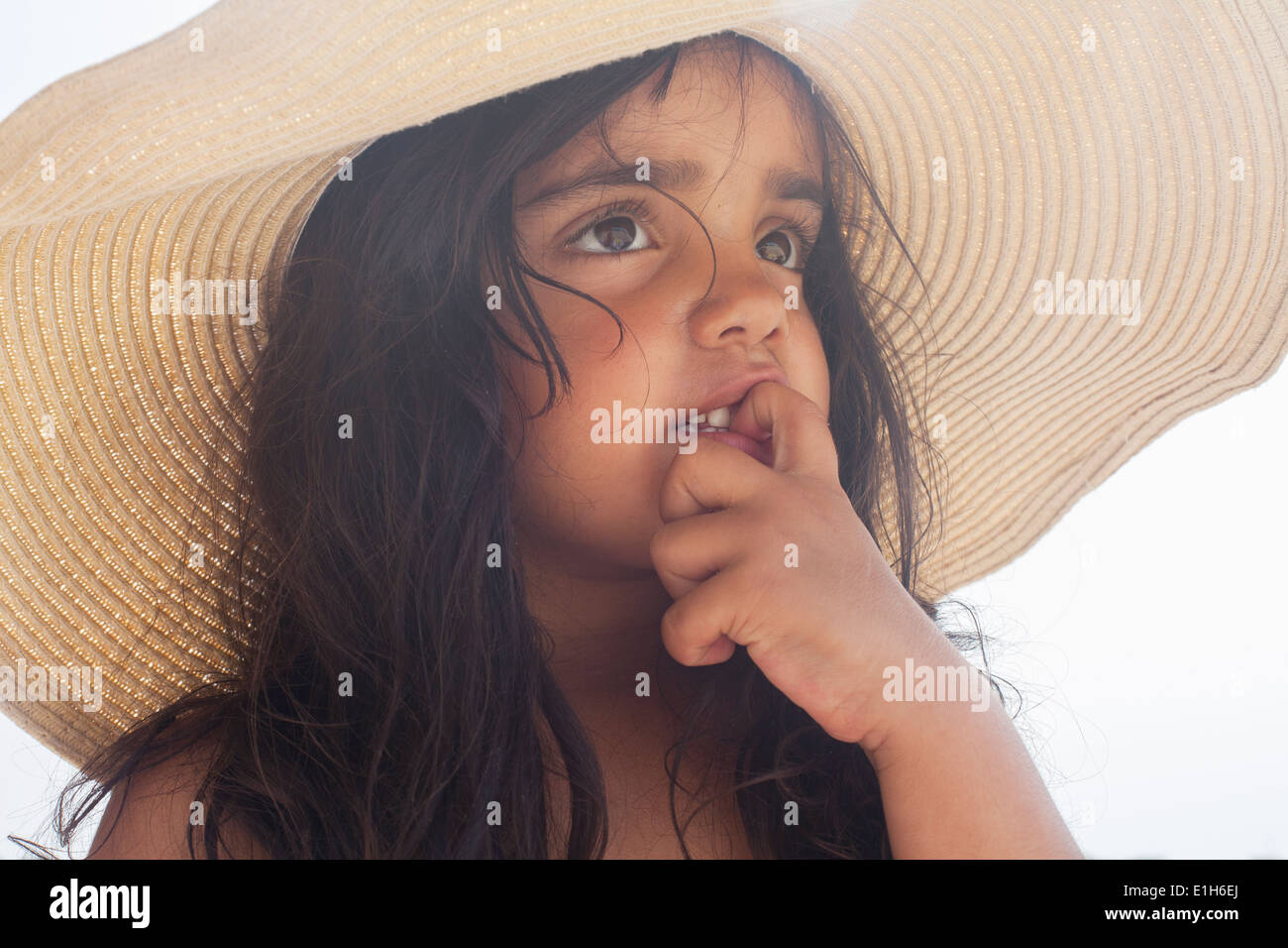 Close up portrait of young girl in sunhat Stock Photo