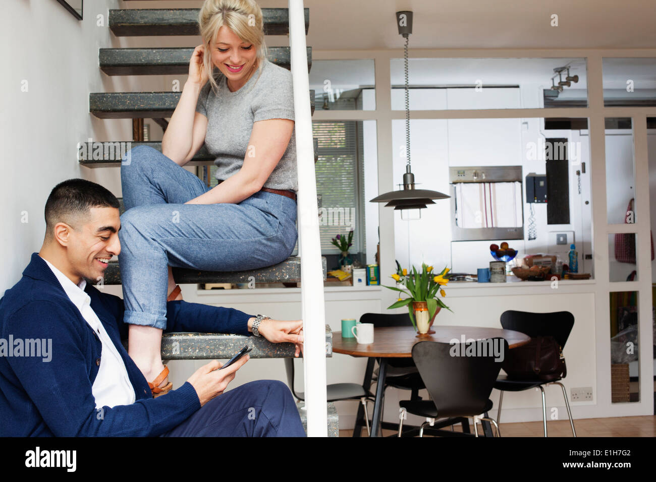 Cool woman man sitting hi-res stock photography and images - Alamy