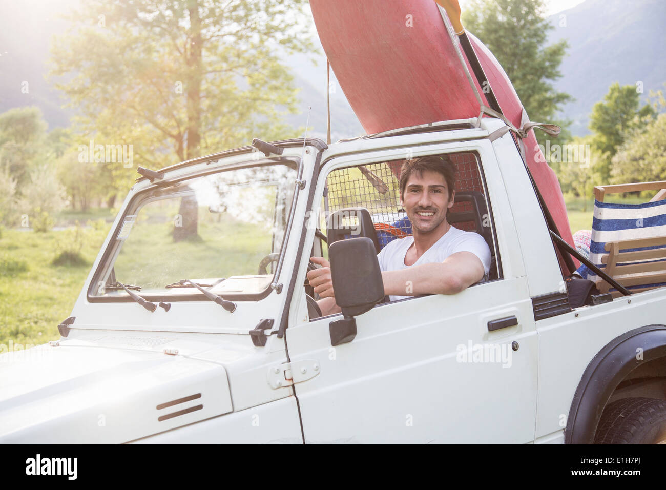 Young man driving off road vehicle Stock Photo