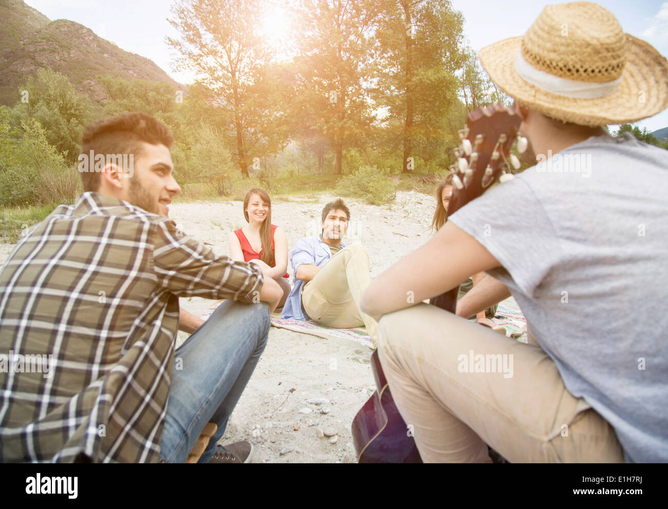 Friends sitting having picnic Stock Photo