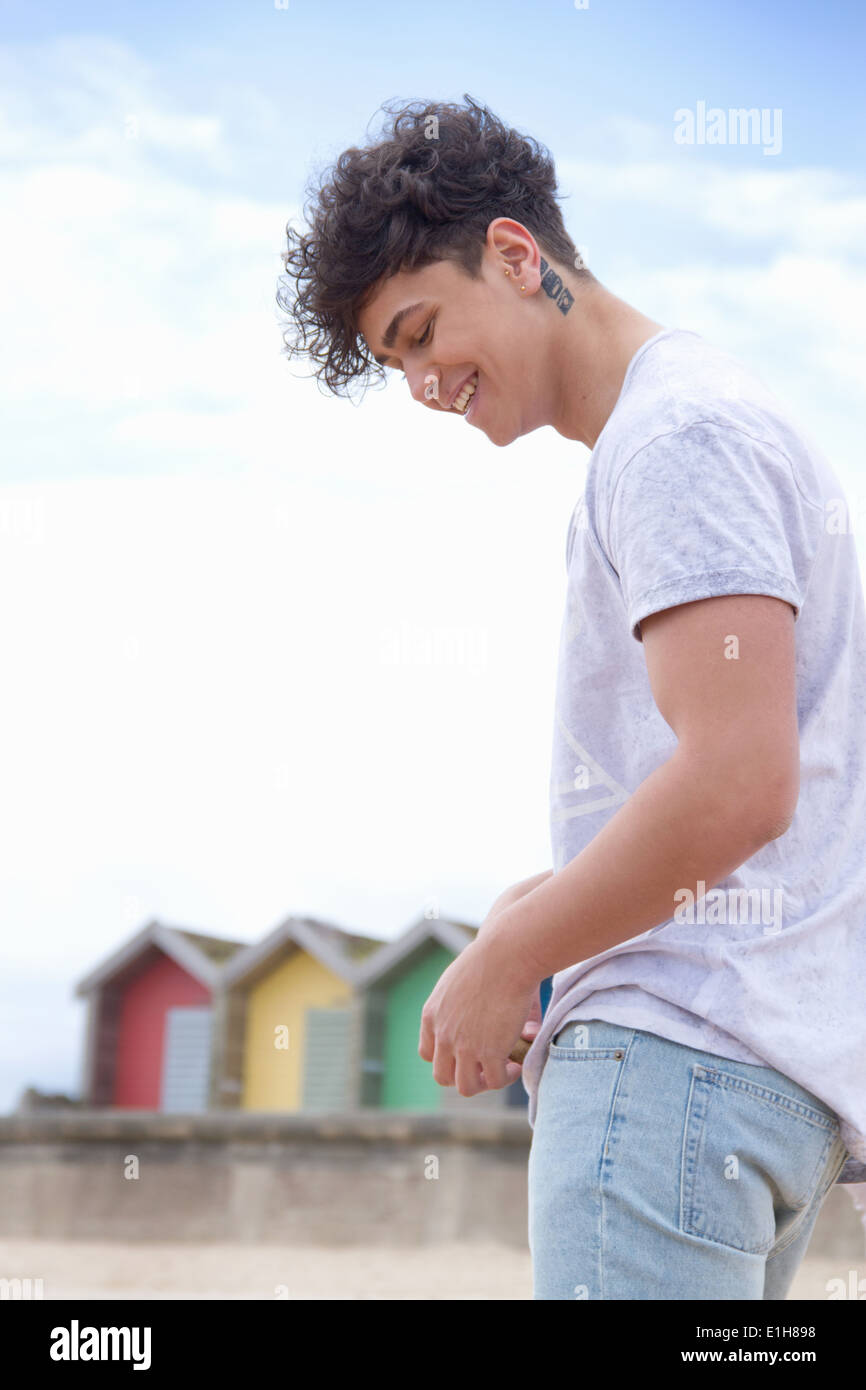 Candid portrait of young man at beach Stock Photo