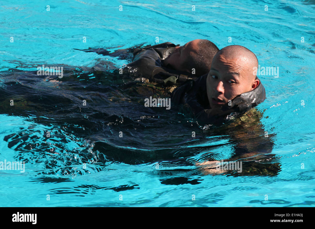 Japan Ground Self-Defense Force (JGSDF) soldiers practice simulated casualty drills during a helocast preparation exercise at M Stock Photo