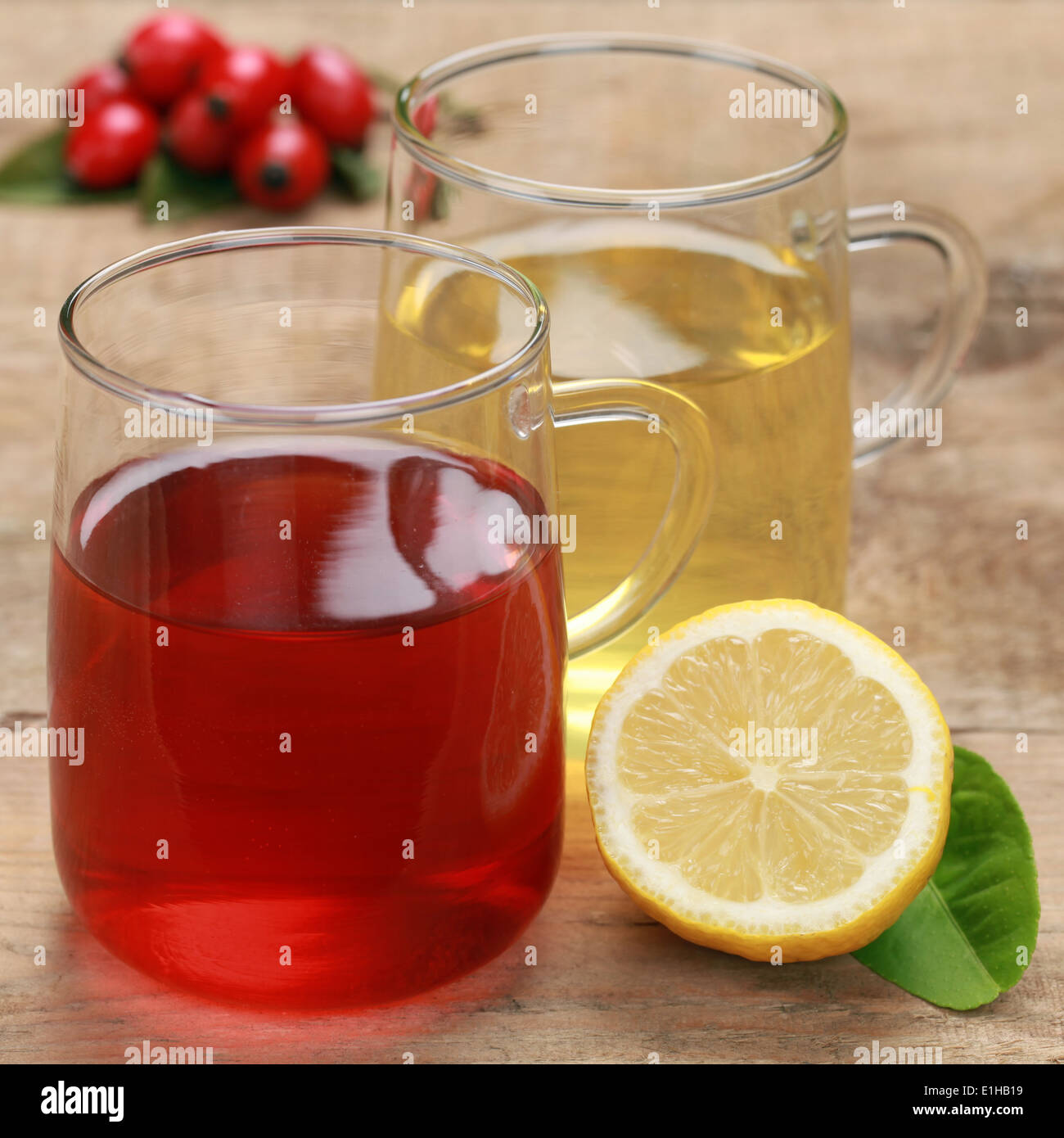 Red and yellow tea in glasses on a wooden table Stock Photo