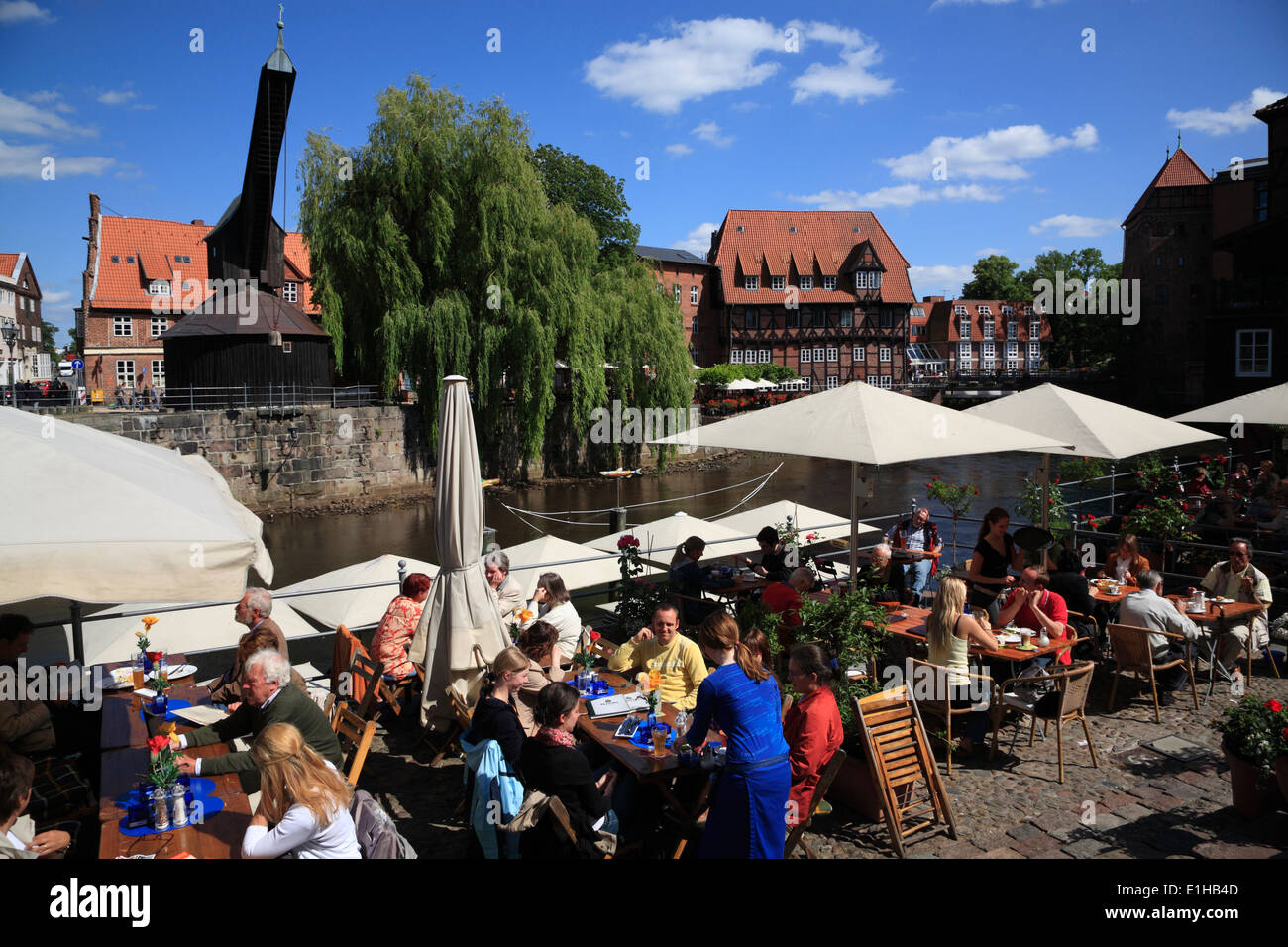 Restaurant and cafe at river Ilmenau in the old harbour at Stintmarkt,  Lueneburg, Lower Saxony, Germany, Europe Stock Photo