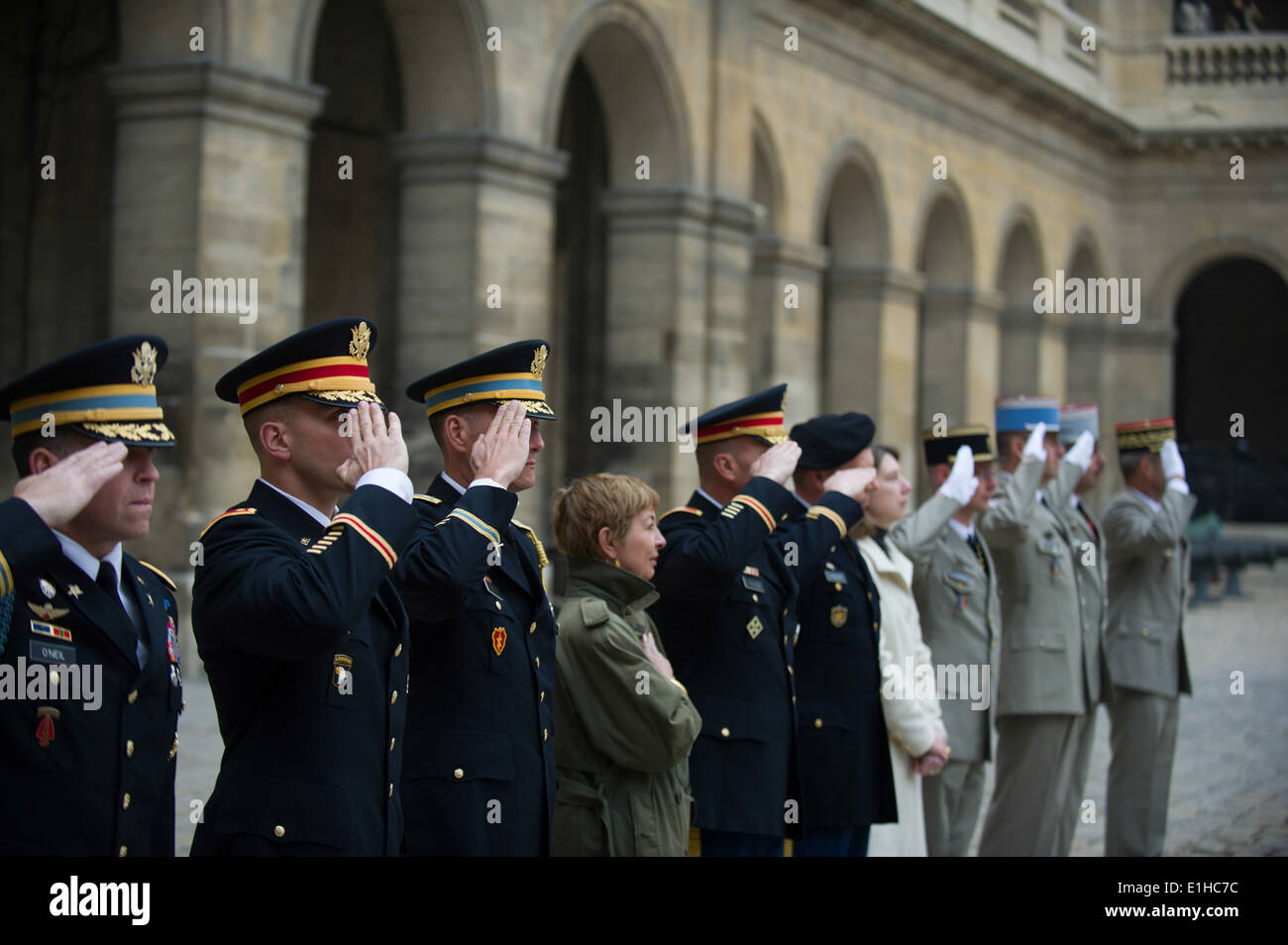 U.S. Army and French army officers salute during a military honors