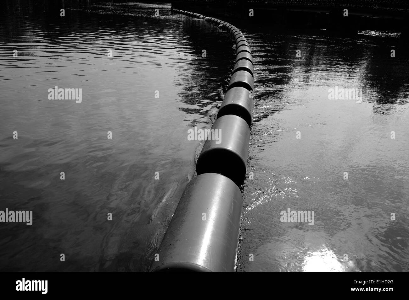 floating blockade on a river Stock Photo