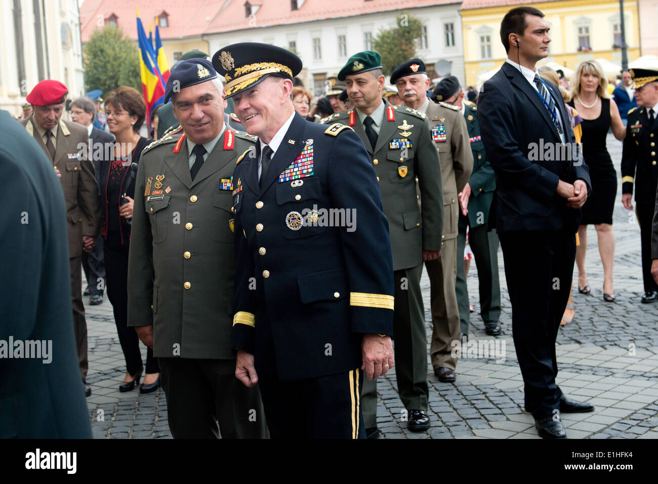 Chairman of the Joint Chiefs of Staff Army Gen. Martin E. Dempsey, center, talks with a defense official of a NATO member natio Stock Photo