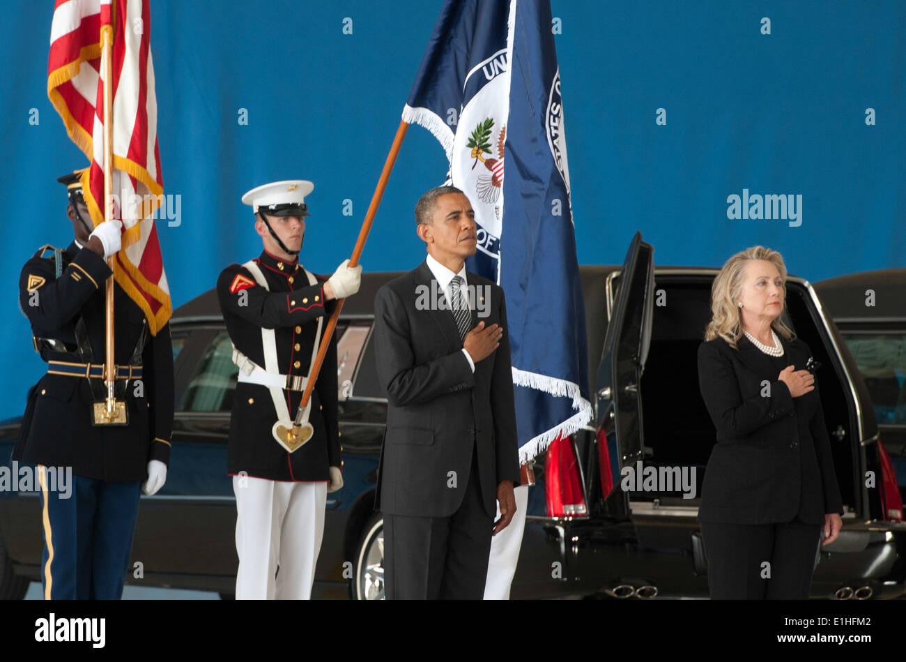 President Barack Obama, second from right, and Secretary of State Hillary Rodham Clinton, right, render honors as the national Stock Photo