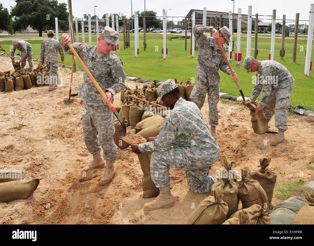 U.S. Soldiers assigned to Naval Construction Training Center Gulfport, Miss., fill sandbags at the center Aug. 27, 2012, in pre Stock Photo
