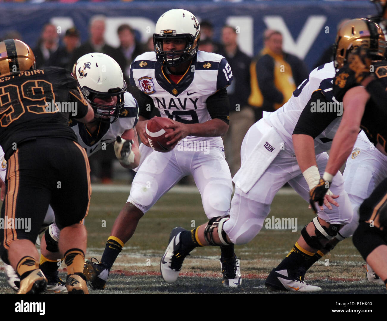 U.S. Naval Academy quarterback Keenan Reynolds dodges U.S. Military Academy defenders during the 113th Army vs. Navy Football g Stock Photo