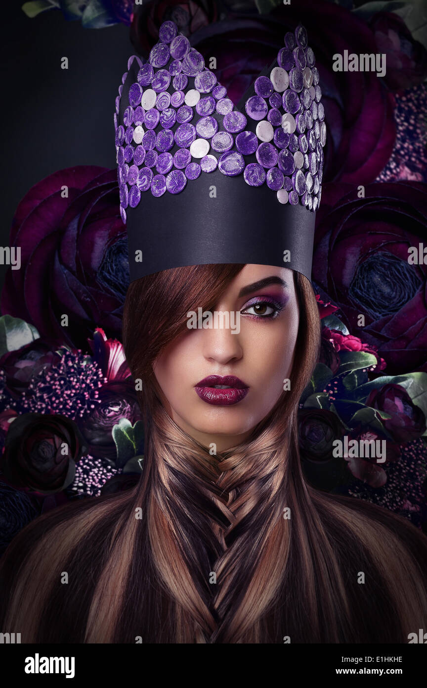 Imagination. Extravagance. Styled Woman in Fantastic Headwear Stock Photo