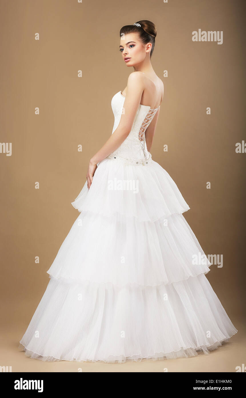 Full Length Portrait of Graceful Bide in White Wedding Dress Stock Photo