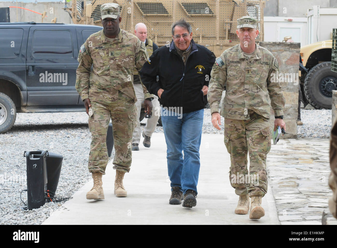 U.S. Secretary of Defense Leon Panetta, center, walks with Army Maj. Gen. Robert Abrams, right, the commanding general of the 3 Stock Photo