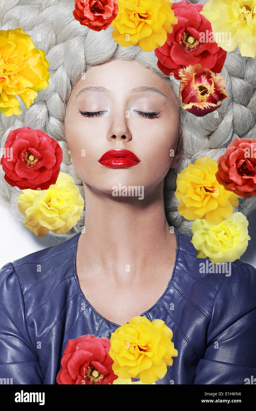 Fantasy. Portrait of Sleeping Woman with Closed Eyes and Colorful Flowers Stock Photo
