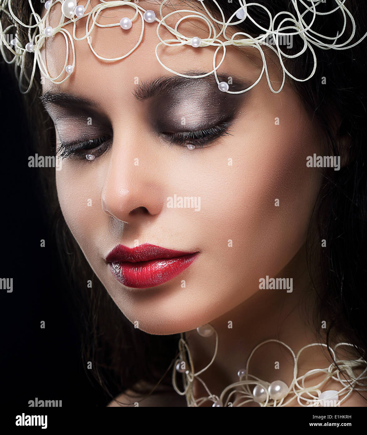 Stylish Fashionable Young Woman with Pearls in Reverie Stock Photo