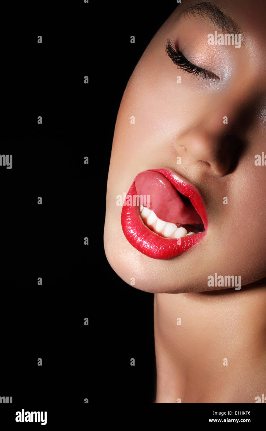 Carnality. Lust. Provocative Woman Licking her Red Sexy Lips. Passion Stock  Photo - Alamy