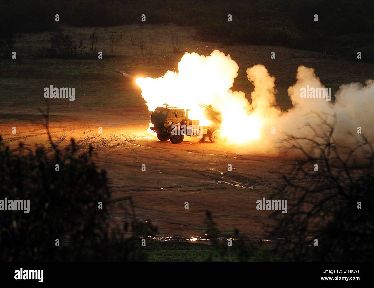 U.S. Marines with 1st Battalion, 11th Marine Regiment, fire a M142 High Mobility Artillery Rocket System (HIMARS), a truck moun Stock Photo