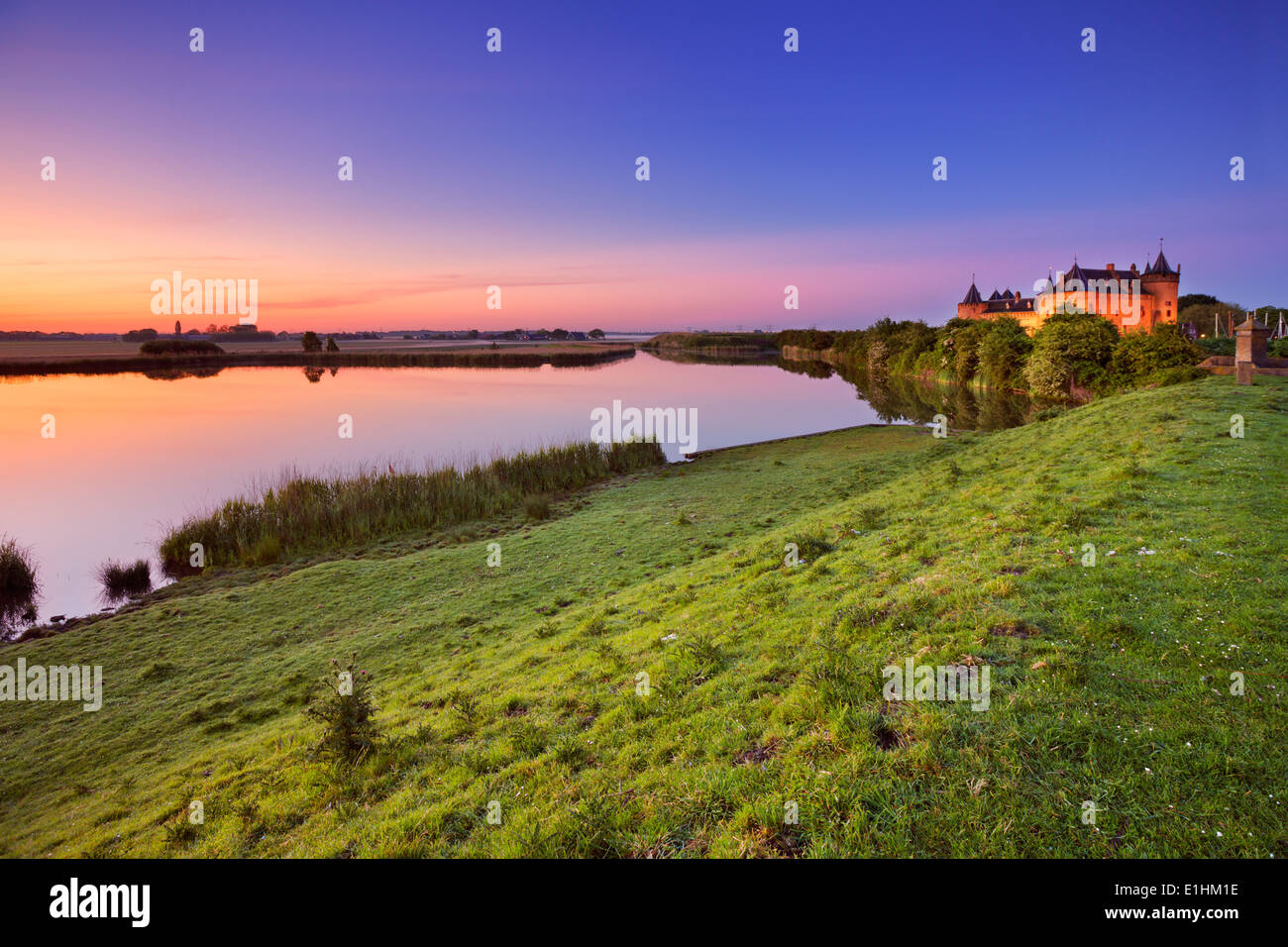 A medieval castle at sunrise Stock Photo - Alamy