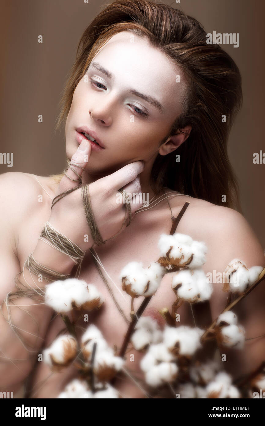 Glamor. Trendy Brown Hair Guy with Bouquet of Flowers Stock Photo