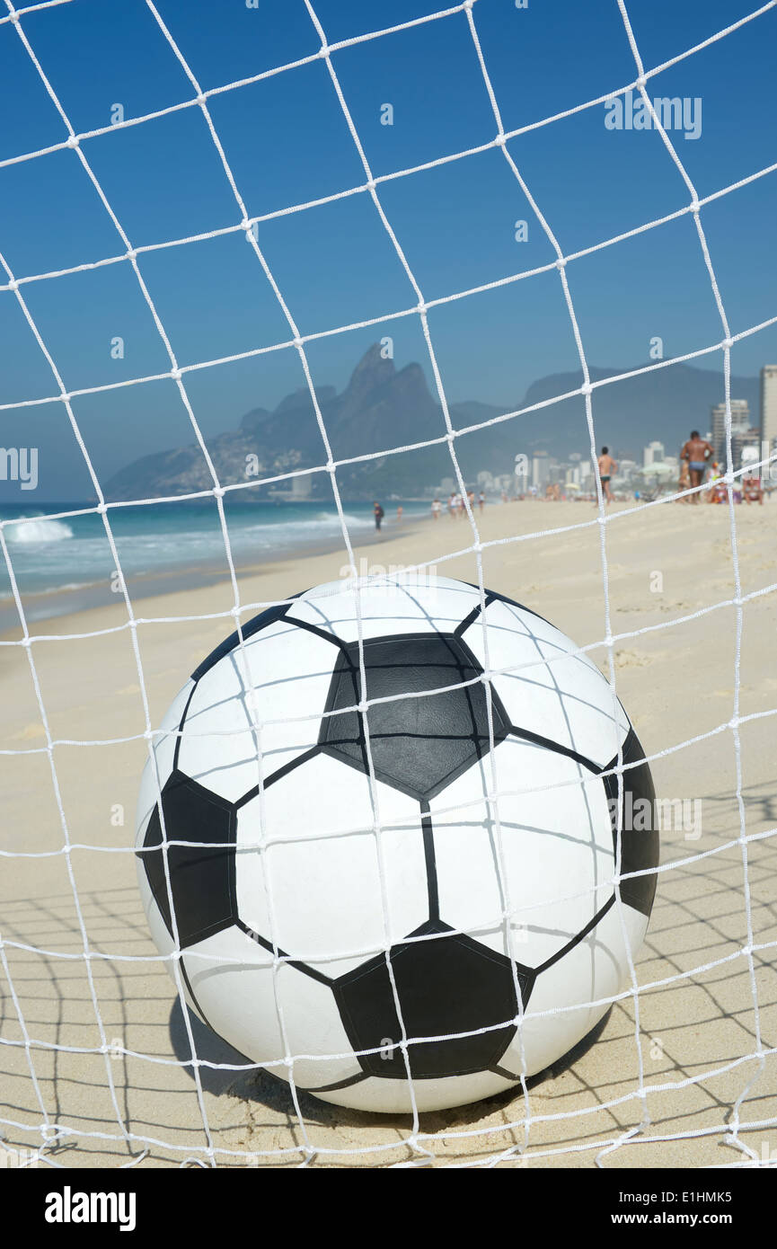 Soccer goal ball in football net on the beach in Rio de Janeiro Brazil