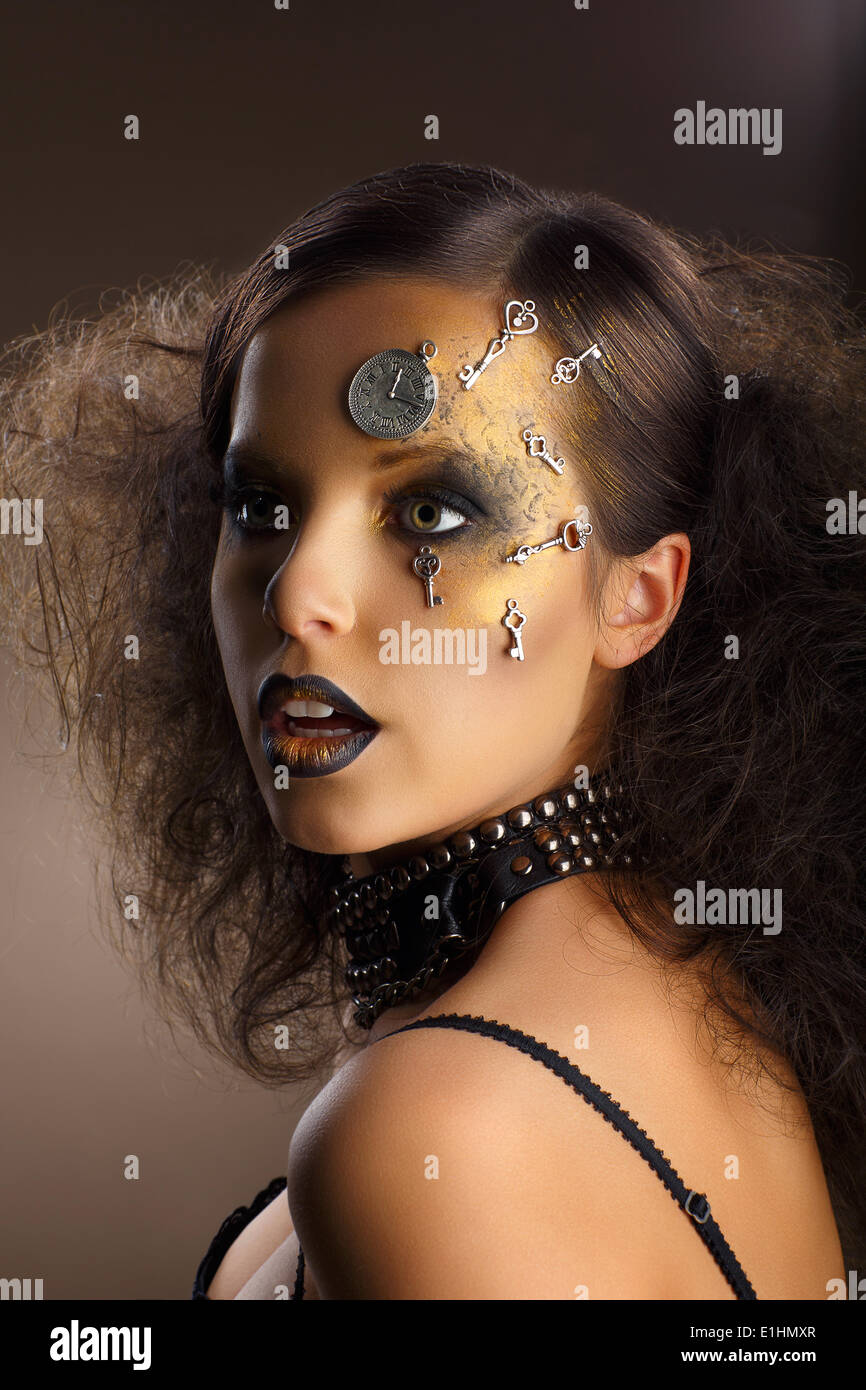 Futurism. Bodyart. Golden Painted Woman's Skin with Silver Accessory. Art Deco Stock Photo