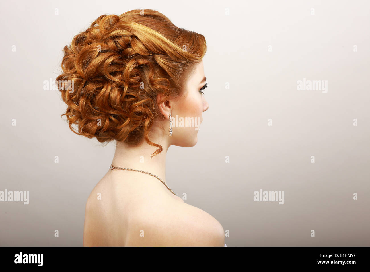 Styling. Rear View of Frizzy Red Hair Woman. Haircare Spa Salon Concept Stock Photo