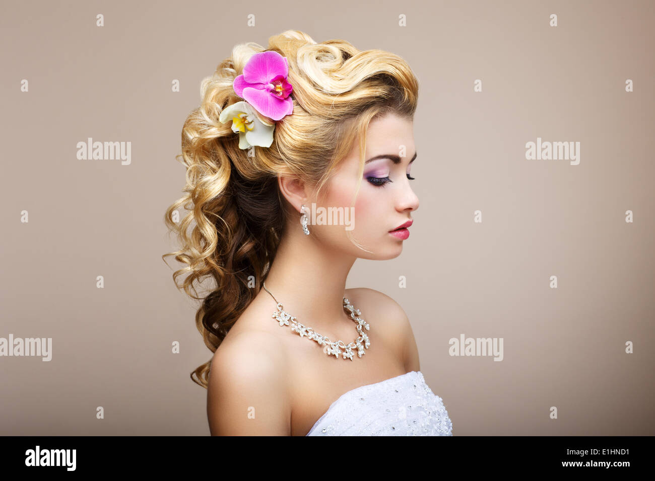 Harmony. Pleasure. Profile of Young Lady with Jewelry - Earrings & Necklace Stock Photo