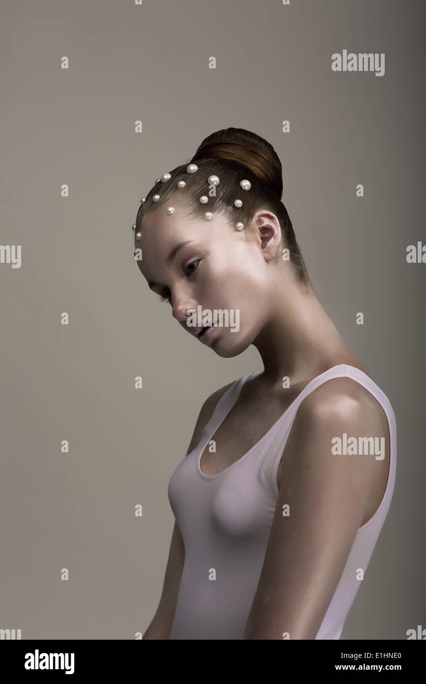 Haute Couture. Glamorous Stylized Enigmatic Woman. Brown - Platinum Color. Futurism Stock Photo