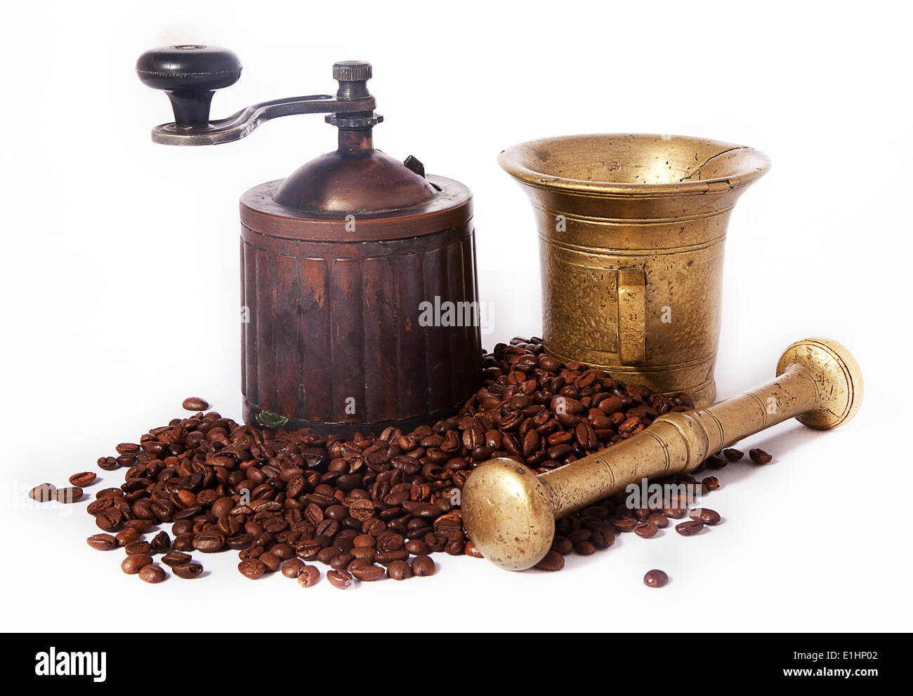 Old-fashioned brazen coffee Grinder and roasted coffee beans - series of photos Stock Photo