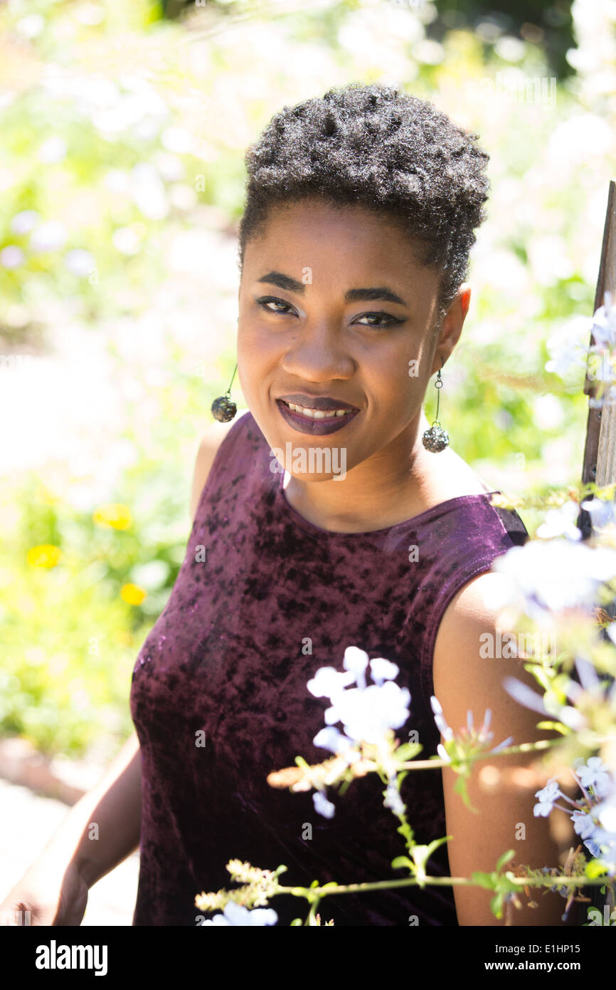 Portrait Of A Young Black Woman With Short Hair In A Garden Stock Photo Alamy
