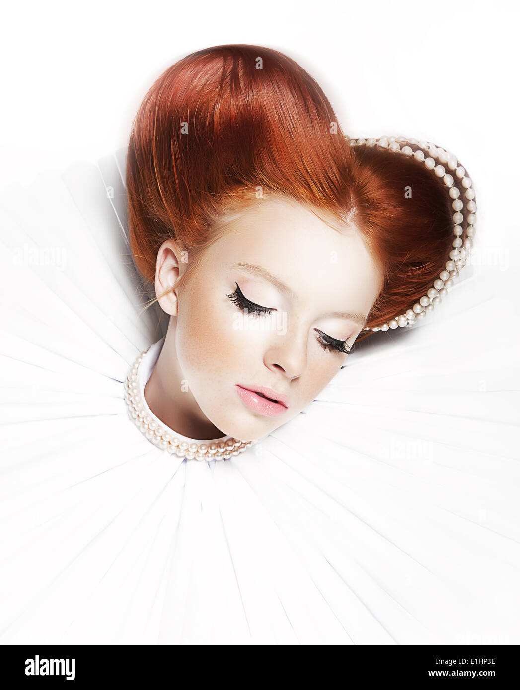 Renaissance style - dreamy cute female - redhead freckled girl with pearly necklace and stagy dramatic make up. Series of photos Stock Photo