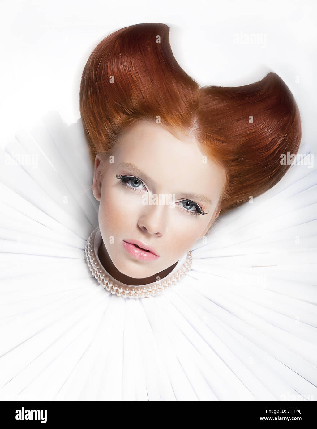 Theatre. Baroque style - young red hair female in white jabot and pearls. Dramatic festive makeup. Close up portrait - series of Stock Photo