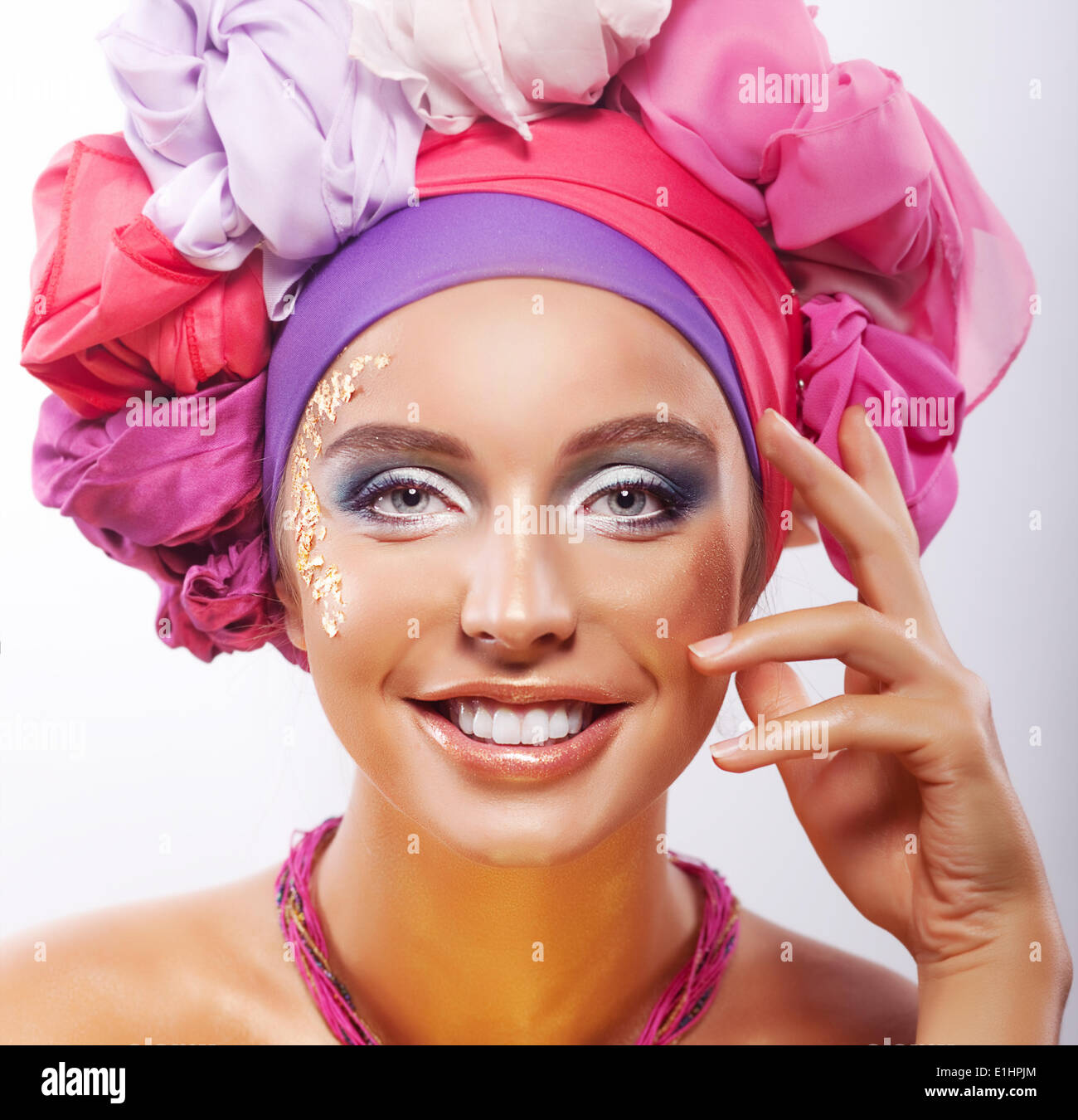 Lifestyle. Beauty. Portrait of young happy toothy smiling woman in colorful headwear Stock Photo