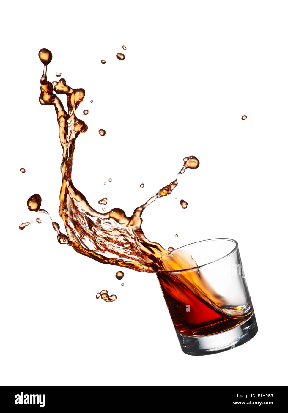 glass of splashing whisky isolated on white Stock Photo