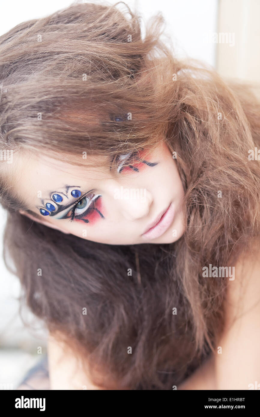 Artistic woman clown - creative art dramatic makeup. Body painting project Stock Photo