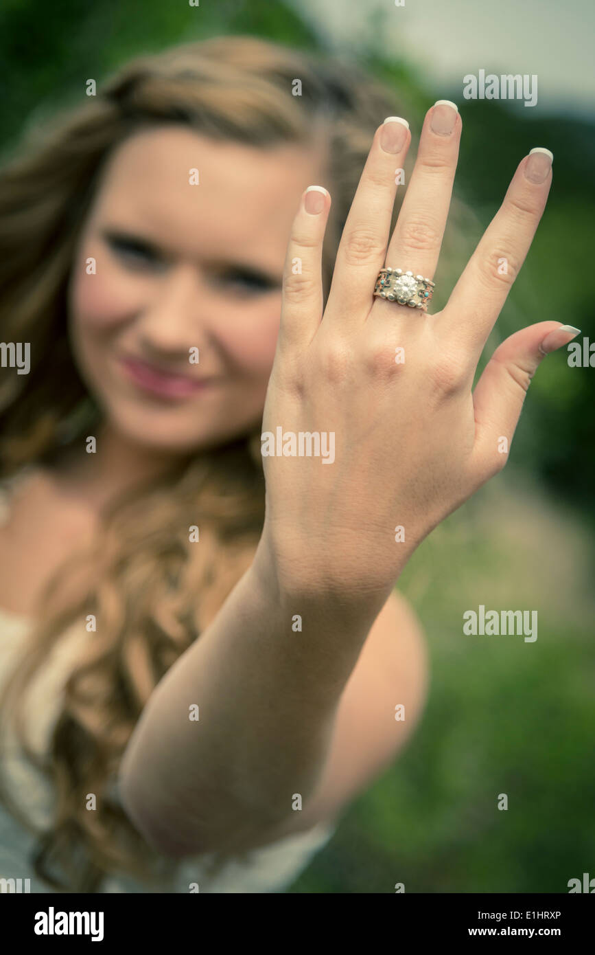 Young woman showing hand with ring Stock Photo - Alamy